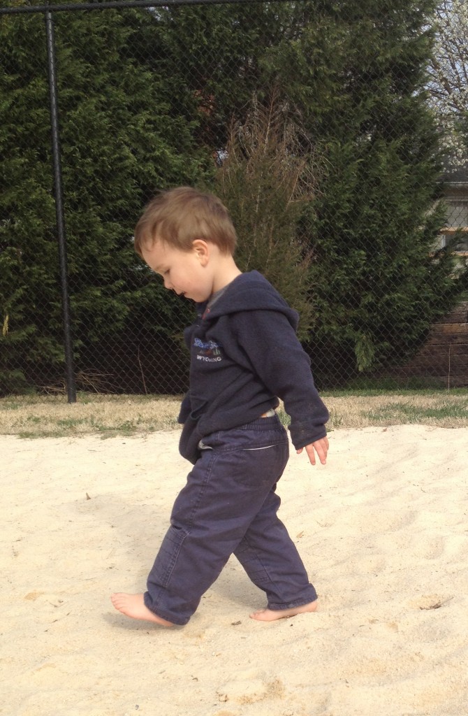 Sans shoes in the sand at a neighborhood park!