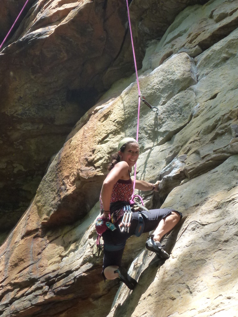 All smiles on Wild Seed (5.11a) at the New River Gorge (Rockin' Capris and Felicity Tunic)