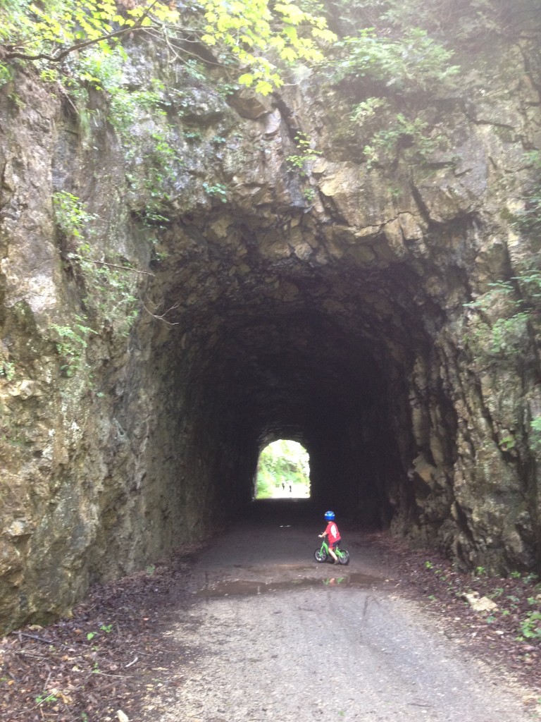 3 year old Big C (balance) biking his way through the New River Trail tunnels in VA.
